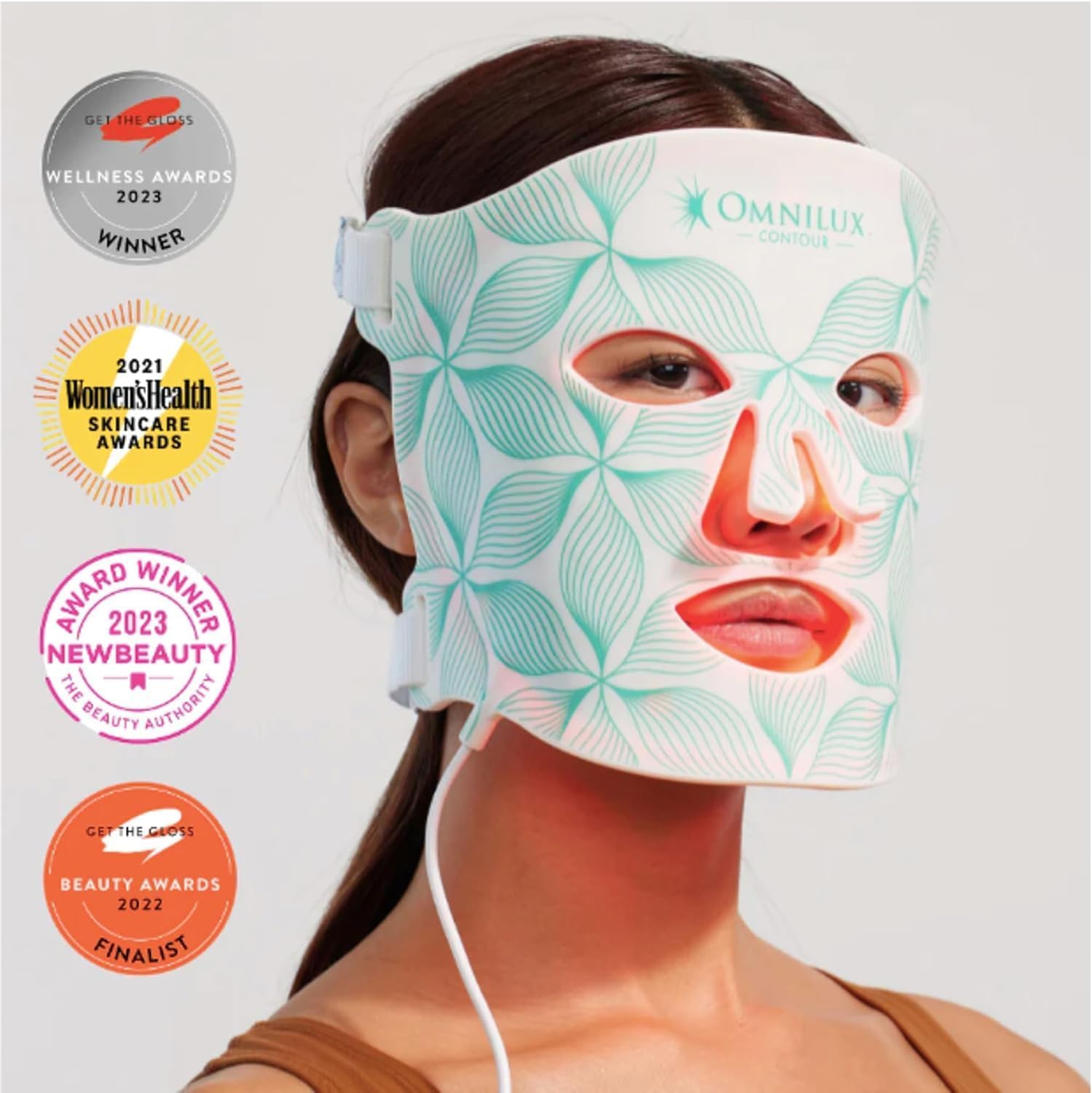 Omnilux Contour Face LED mask worn showing flexible medical-grade silicone with award badges