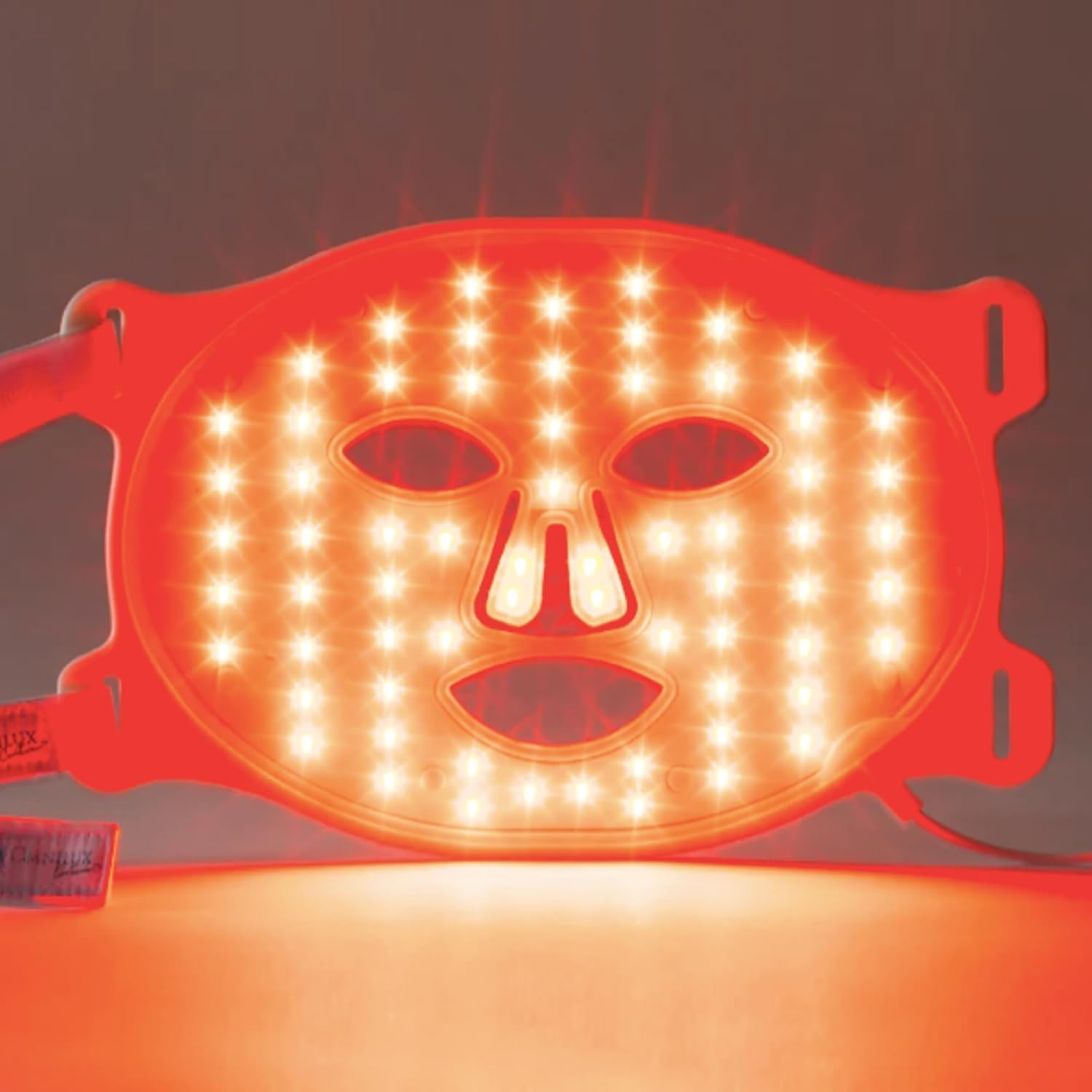 Omnilux Contour Face LED mask glowing red from inside